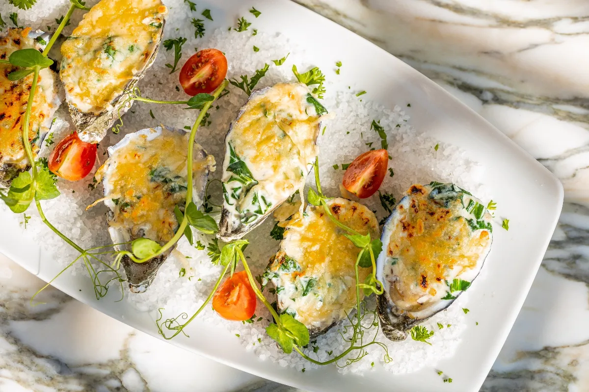 rockefeller oysters at hotel mousai puerto vallarta rooftop restaurant